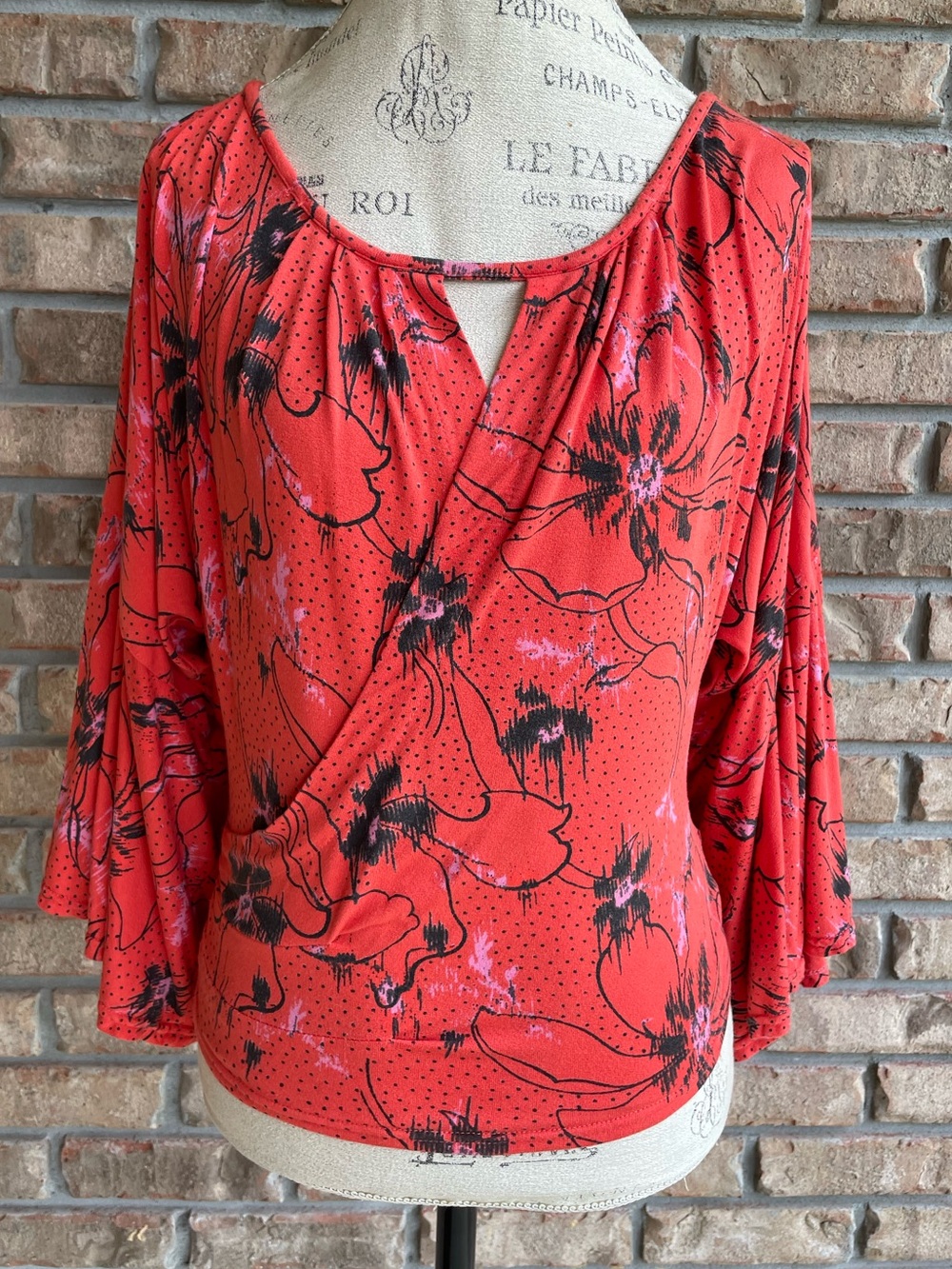 Free People Coral Red Boho Floral Faux Wrap Top with Bell Sleeves.